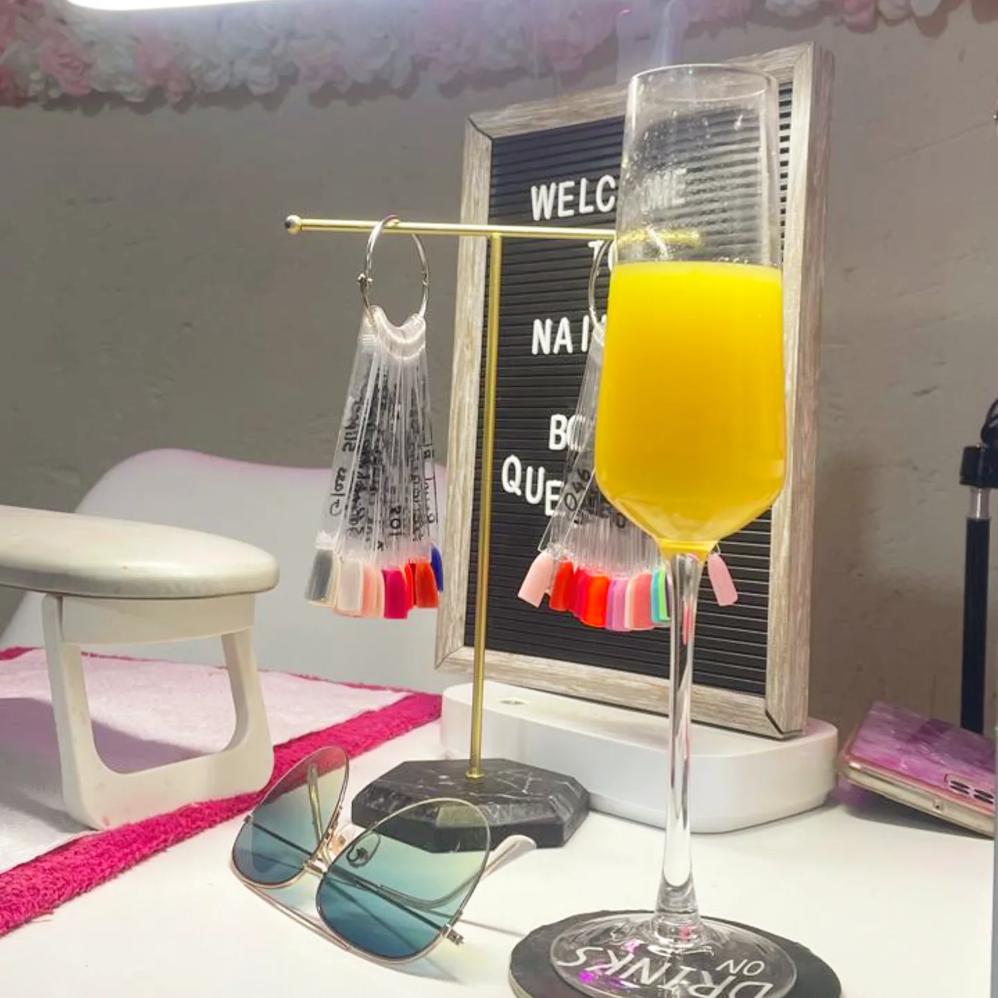 The Nailed by Boity studio — welcome board, mimosa and nail swatches