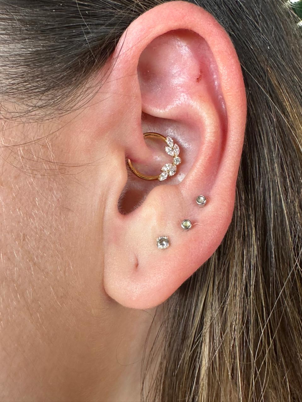 Healed daith and lobe piercings with gold jewellery by Ray